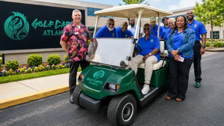The Golf Carts Atlanta team with a green Golf Carts Atlanta cart